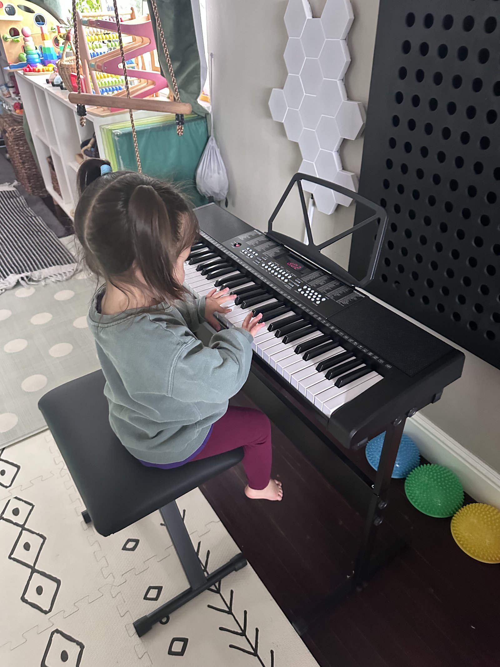 Children exploring music at the keyboard