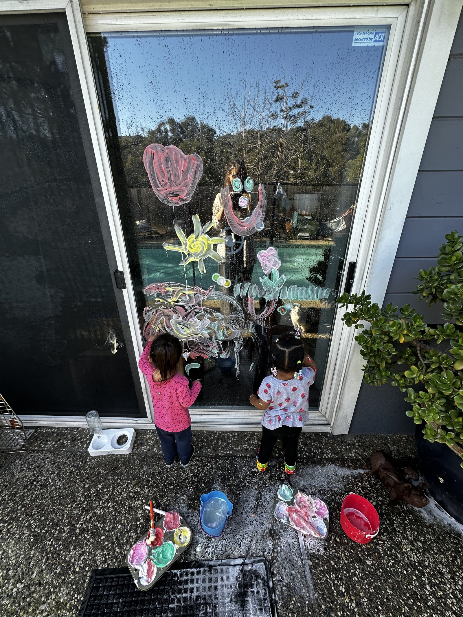 Children's artwork covering the glass door